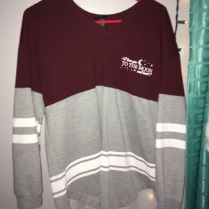 a long sleeve maroon gray and white t-shirt